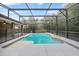 Well-maintained in-ground pool featuring a screened enclosure, perfect for relaxation and outdoor fun at 157 Ambergate Ct, Debary, FL 32713