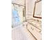 Bathroom featuring a glass-enclosed shower and vanity with granite countertop at 16041 Lagoon Dr, Clermont, FL 34711