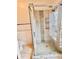 Large shower with decorative tile, glass door, and shower head at 16041 Lagoon Dr, Clermont, FL 34711