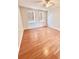 Bright bedroom is complete with a ceiling fan and two windows with blinds to offer a cozy ambiance at 16041 Lagoon Dr, Clermont, FL 34711