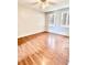 Bedroom with hardwood floors and two windows, creating a bright and inviting atmosphere at 16041 Lagoon Dr, Clermont, FL 34711