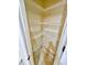 Spacious empty closet with white shelving for storage at 16041 Lagoon Dr, Clermont, FL 34711