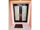 Close up shot of the front doors with glass inserts at 16041 Lagoon Dr, Clermont, FL 34711