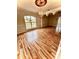 Elegant living room featuring hardwood floors, decorative ceiling, and arched doorways at 16041 Lagoon Dr, Clermont, FL 34711