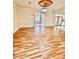 Large living room featuring hardwood floors and natural light at 16041 Lagoon Dr, Clermont, FL 34711