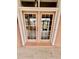 Double doors opening onto a patio, offering seamless indoor-outdoor transition at 16041 Lagoon Dr, Clermont, FL 34711