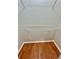 Practical walk-in closet with laminate flooring and wire shelving at 16041 Lagoon Dr, Clermont, FL 34711