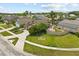 Suburban neighborhood street view with well-maintained lawns, mature trees, and a charming single-Gathering home at 219 Old Mill Cir, Kissimmee, FL 34746