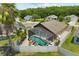 Aerial view of the screened pool and backyard area, perfect for outdoor entertaining and relaxation at 219 Old Mill Cir, Kissimmee, FL 34746