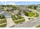Property featuring a well-maintained lawn and landscaping, complemented by a long driveway and two-car garage at 219 Old Mill Cir, Kissimmee, FL 34746