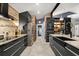 Modern kitchen with stainless steel appliances, granite countertops, and sleek cabinetry at 219 Old Mill Cir, Kissimmee, FL 34746
