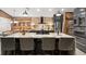 Spacious kitchen with a large center island, pendant lighting, and modern stainless-steel appliances at 219 Old Mill Cir, Kissimmee, FL 34746