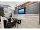 Stylish living room featuring modern entertainment center with a large television and comfortable seating at 219 Old Mill Cir, Kissimmee, FL 34746
