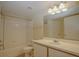 Clean bathroom featuring a shower-tub combo, a toilet, and a single-sink vanity at 2208 Antigua Pl # 932, Kissimmee, FL 34741