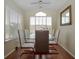 Dining area with glass table, seating for six, and natural light at 2208 Antigua Pl # 932, Kissimmee, FL 34741