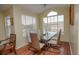 Dining area with glass table, seating for six, and lots of natural light at 2208 Antigua Pl # 932, Kissimmee, FL 34741