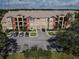 Apartment complex with colorful exterior, parking, and beautiful landscaping at 2208 Antigua Pl # 932, Kissimmee, FL 34741