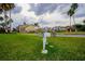 Ornamental white bike with flowers in the community front lawn at 2208 Antigua Pl # 932, Kissimmee, FL 34741