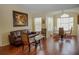 Comfortable living room area with hardwood floors, lots of light, and a dining area at 2208 Antigua Pl # 932, Kissimmee, FL 34741