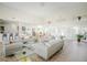 Bright community lobby with tile flooring, soaring ceiling, lots of seating, and a partial view of the kitchen at 2208 Antigua Pl # 932, Kissimmee, FL 34741