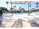Relaxing community pool area with a shaded cabana and sun loungers for residents at 2208 Antigua Pl # 932, Kissimmee, FL 34741