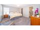 Primary bedroom featuring great natural light, ceiling fan, ensuite, and ample closet space at 2226 Majestic Span Ave, Eagle Lake, FL 33839