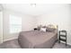 Neutral bedroom with a large window for natural light and comfortable carpet at 2226 Majestic Span Ave, Eagle Lake, FL 33839