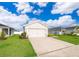 Charming single-Gathering home features a two-car garage and well-maintained lawn at 2226 Majestic Span Ave, Eagle Lake, FL 33839