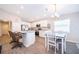 Modern kitchen with white cabinets, stainless steel appliances, and a breakfast bar at 2226 Majestic Span Ave, Eagle Lake, FL 33839