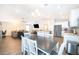 Bright kitchen with stainless steel appliances opens to dining and living areas at 2226 Majestic Span Ave, Eagle Lake, FL 33839