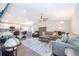 Spacious living room with wood flooring and an open floor plan to the kitchen at 2226 Majestic Span Ave, Eagle Lake, FL 33839
