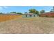Expansive backyard providing ample space and privacy with a wooden fence at 225 Indiana St, Leesburg, FL 34748
