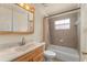 Classic bathroom with vanity, tiled shower and neutral colors at 225 Indiana St, Leesburg, FL 34748