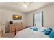 Comfortable bedroom with TV, natural light and soft carpet at 225 Indiana St, Leesburg, FL 34748