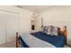 Neutral colored bedroom with a view out into the living room at 225 Indiana St, Leesburg, FL 34748
