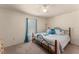 Bright bedroom with a ceiling fan and light blue accents at 225 Indiana St, Leesburg, FL 34748