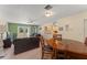 Open living space featuring a living room, dining area, and a glimpse of the kitchen at 225 Indiana St, Leesburg, FL 34748