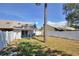 Spacious backyard with a high white fence and lots of shade at 2714 Hunt Club Ln, Orlando, FL 32826