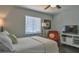 Serene bedroom with a comfortable queen bed, stylish decor, and a cozy seating area with natural light at 2714 Hunt Club Ln, Orlando, FL 32826