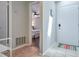 Inviting foyer with tile flooring, a bright white door, and a glimpse into a beautifully staged bedroom at 2714 Hunt Club Ln, Orlando, FL 32826