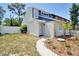 Two-story home with freshly landscaped front yard and a charming walkway leading to the front door at 2714 Hunt Club Ln, Orlando, FL 32826