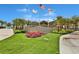 Community entrance with manicured landscaping and decorative signage at 3013 Latitude Ln, Kissimmee, FL 34747