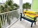 Balcony with a custom bench overlooking the neighborhood at 3013 Latitude Ln, Kissimmee, FL 34747