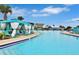 Stunning community pool with luxurious cabanas and ample seating for relaxation at 3013 Latitude Ln, Kissimmee, FL 34747