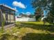 Spacious backyard with a white fence and lush green grass, ideal for recreation at 3123 Tamarind Dr, Edgewater, FL 32141
