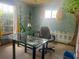 Bright room features a desk and dual windows allowing natural light and a whimsical design at 3123 Tamarind Dr, Edgewater, FL 32141