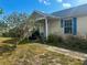 Charming home featuring a covered front porch with seating area at 3123 Tamarind Dr, Edgewater, FL 32141