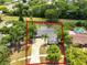 Aerial view of the home with green lawn and large trees at 3520 Balsam Dr, Winter Park, FL 32792