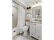 Well-lit bathroom with tiled shower, stylish vanity, and modern fixtures at 3520 Balsam Dr, Winter Park, FL 32792
