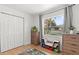 Bedroom featuring a large window, built-in storage, and a playful area rug at 3520 Balsam Dr, Winter Park, FL 32792